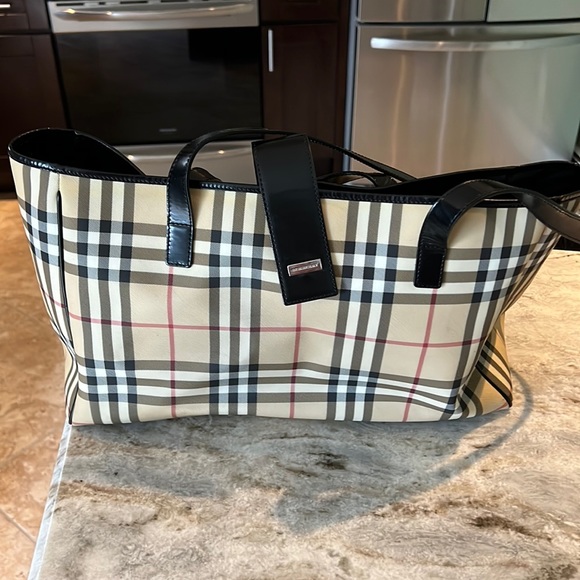 Burberry Handbags - Authentic Burberry baby bag two bottle holder inside comes with diaper bag…